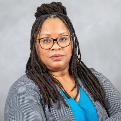 Photo of Christie looking at the camera