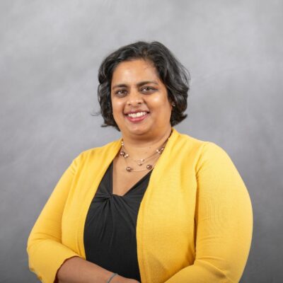 Photo of Sam smiling at the camera