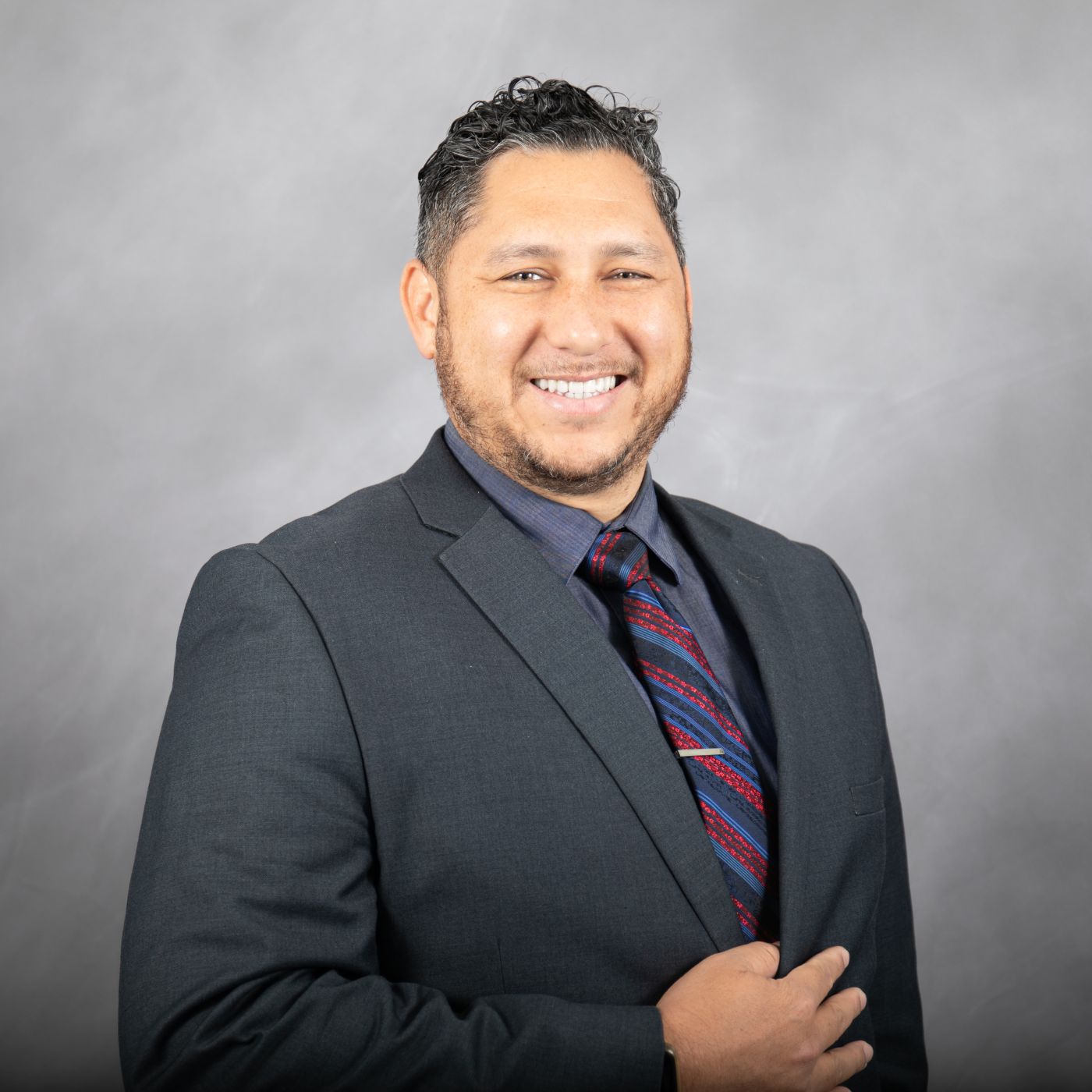 Photo of Branden smiling at the camera