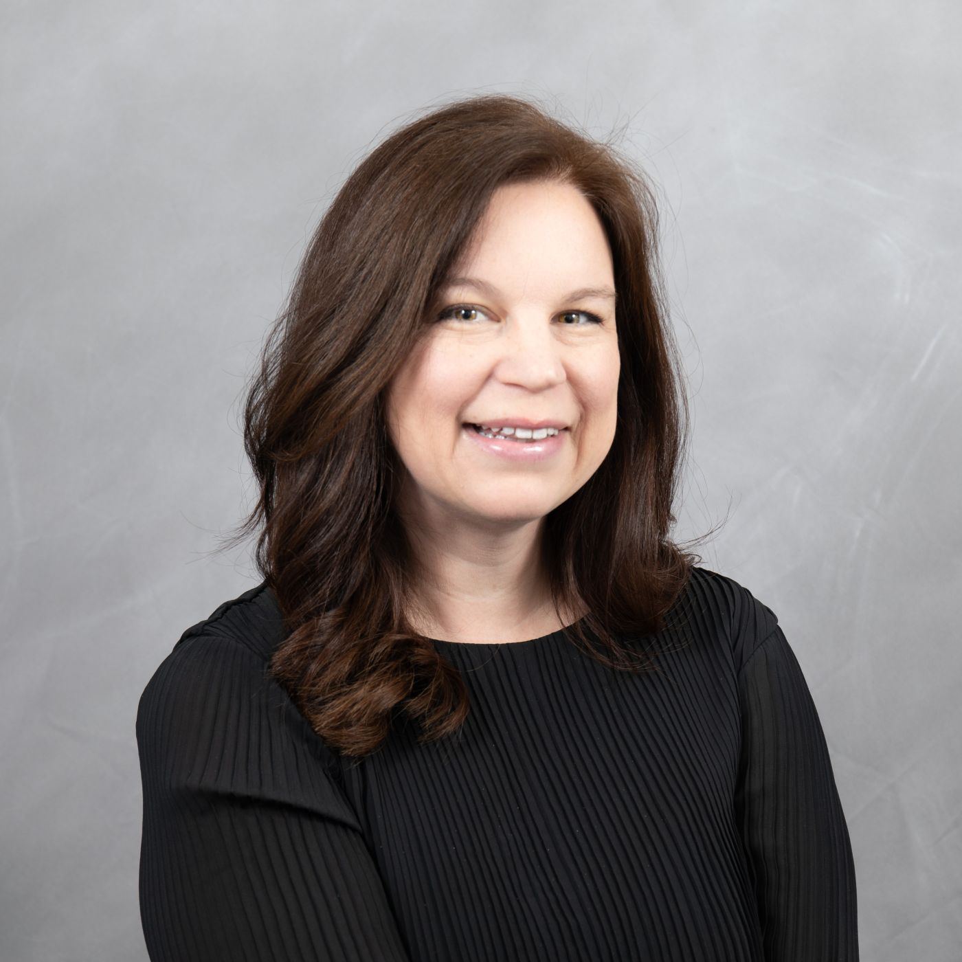 Photo of Courtney smiling at the camera