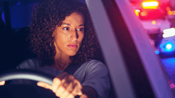 woman stopped by police car