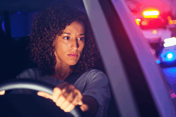 woman stopped by police car