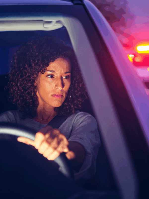 woman stopped by police car