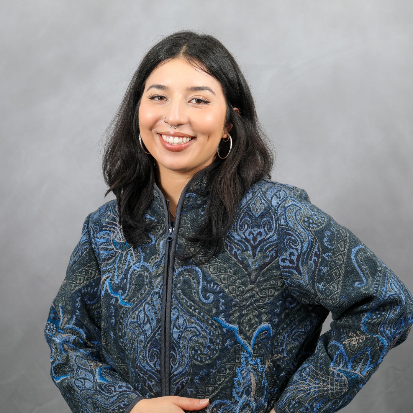 Photo of Kamilah smiling at the camera