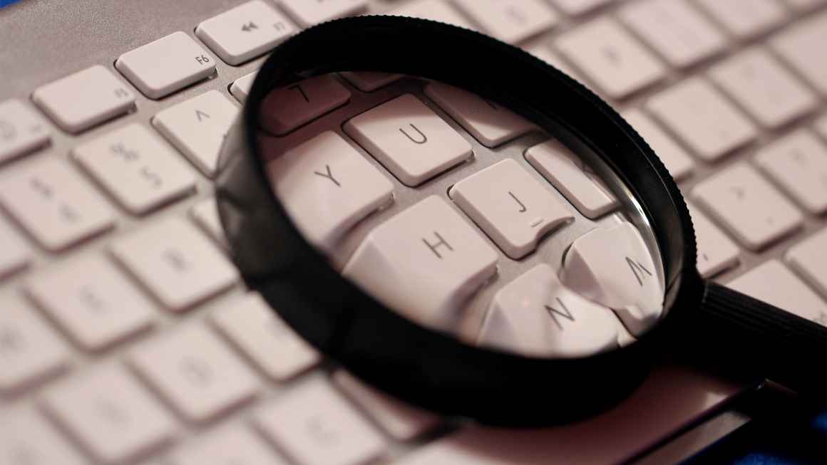 Image of a magnifying glass on a keyboard